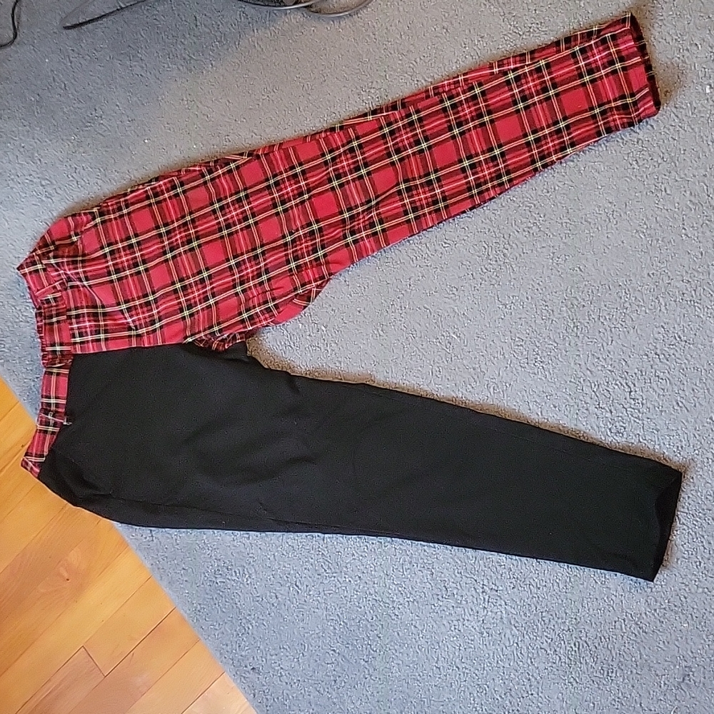 Half red plad, half black pants.